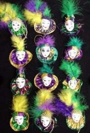 Mardi Gras pins, brooches, and magnets featuring painted ceramic doll faces and Venetian masks are great costume accessories, souvenirs, and memorabilia. 